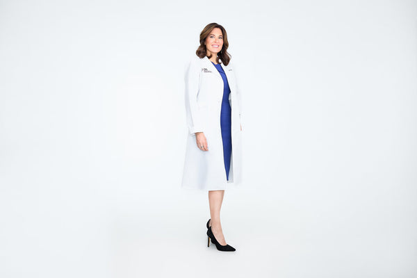Dr. Doris Day, board-certified dermatologist, in her white coat